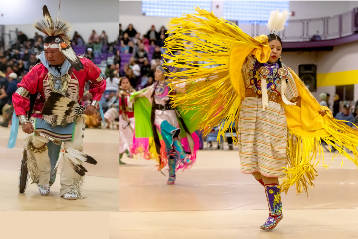 Two dancers in their tribal regalia dancing at a Pow Wow