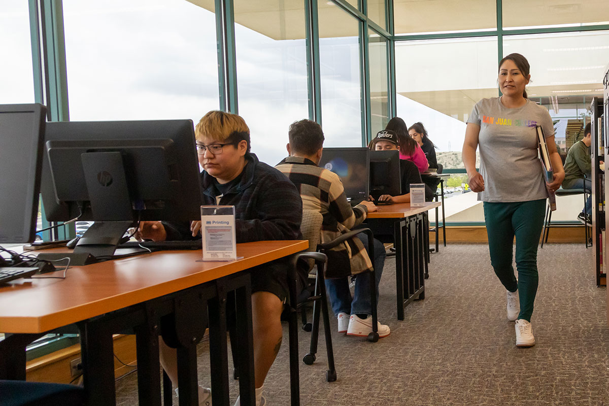 Group of students studying in front of their computers in the library at SJC