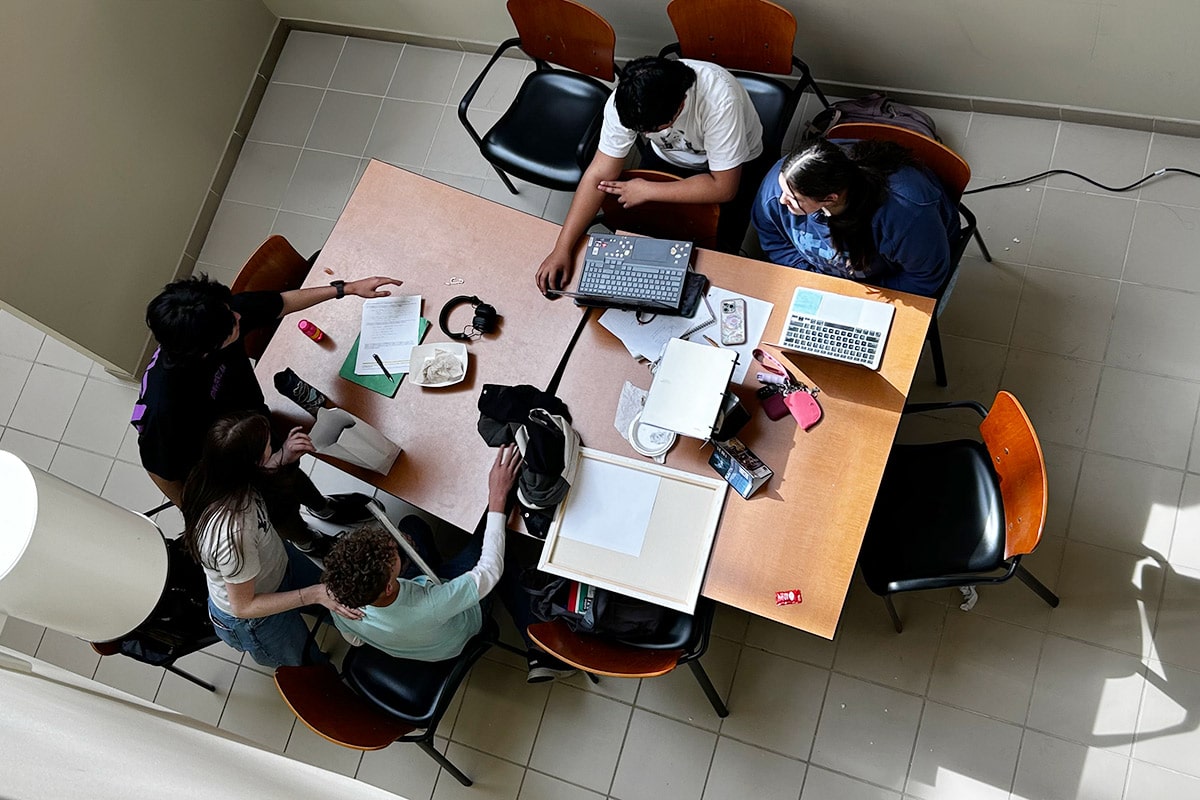 A group of TRIO students sitting around a table studying on San Juan College Main Campus