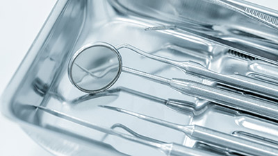 A tray of dental equipment tools