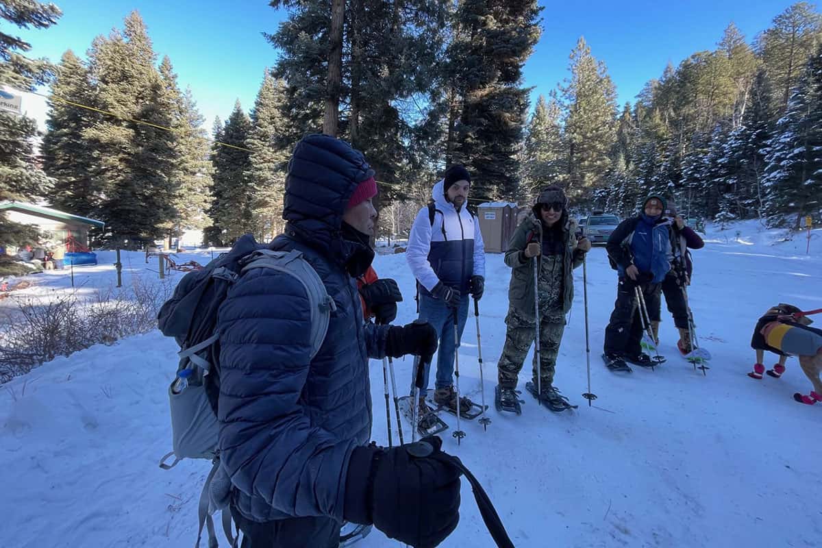 A group of SJC students out snowshoeing using equipment from the SJC Rental Center.