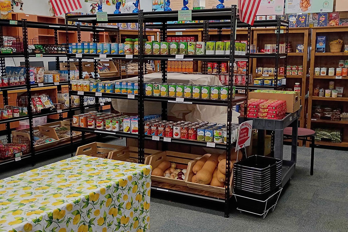 Racks of canned goods, fruits and vegetables.